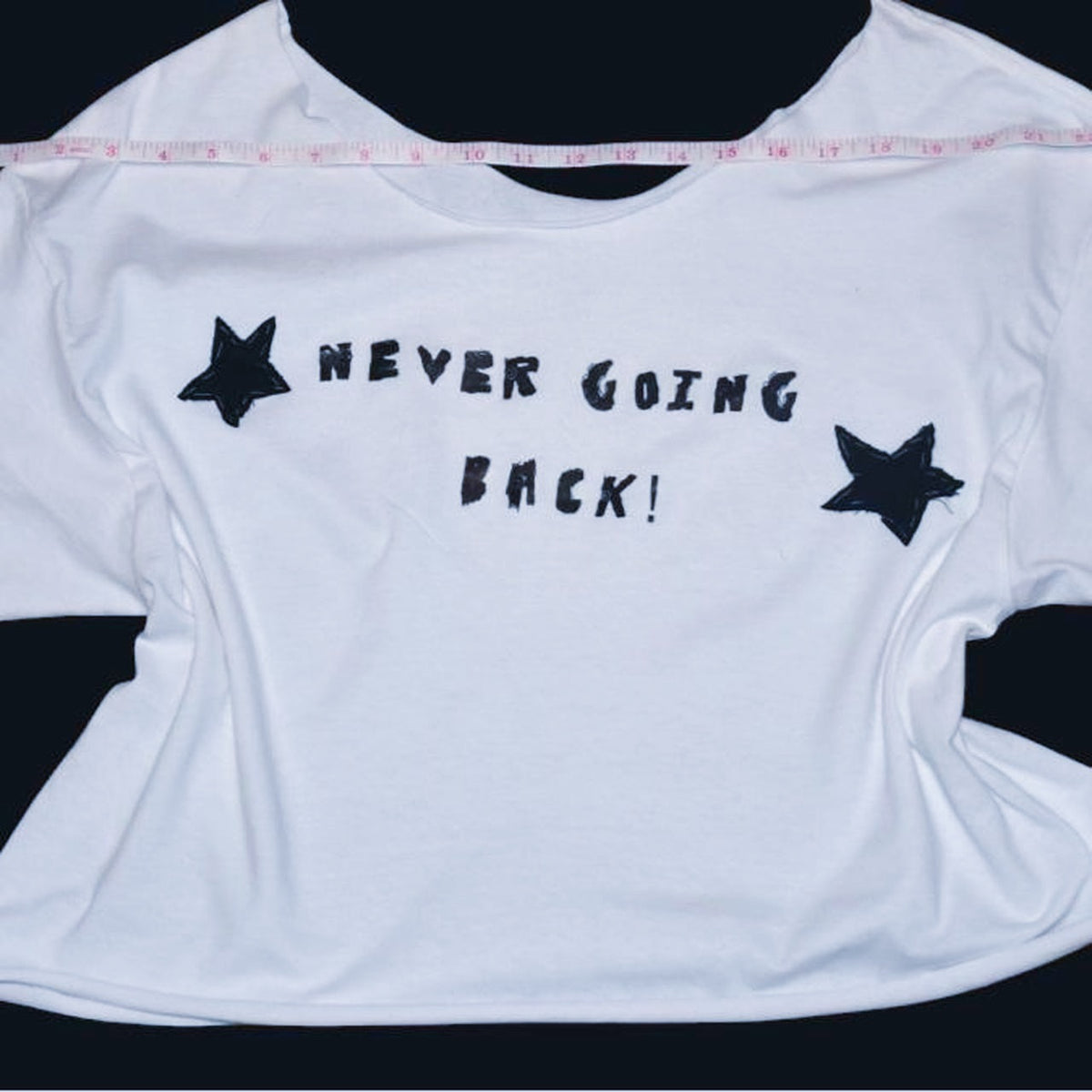 white off the shoulder phoebe bridgers inspired graphic tee | hand sewed black fabric stars