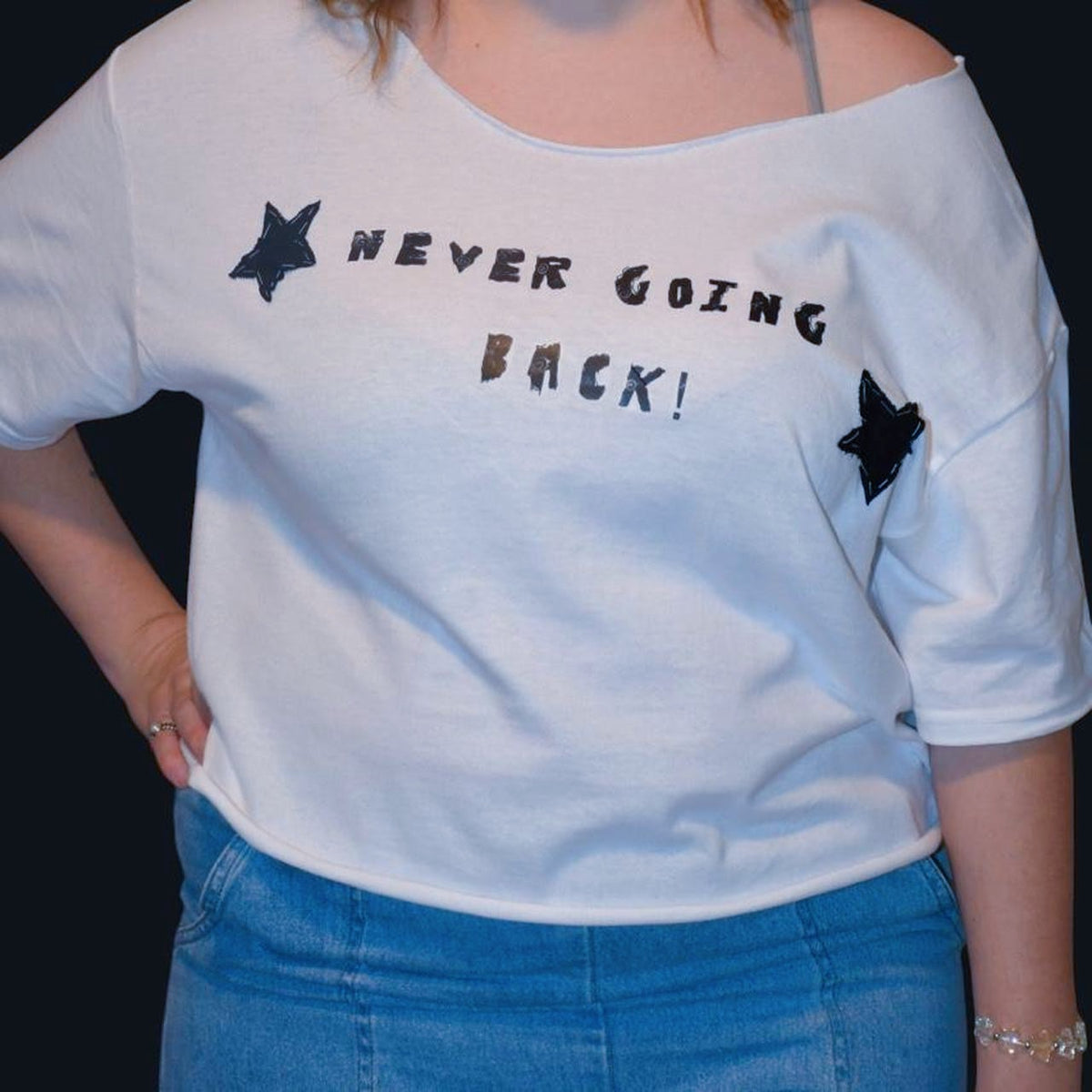white off the shoulder phoebe bridgers inspired graphic tee | hand sewed black fabric stars