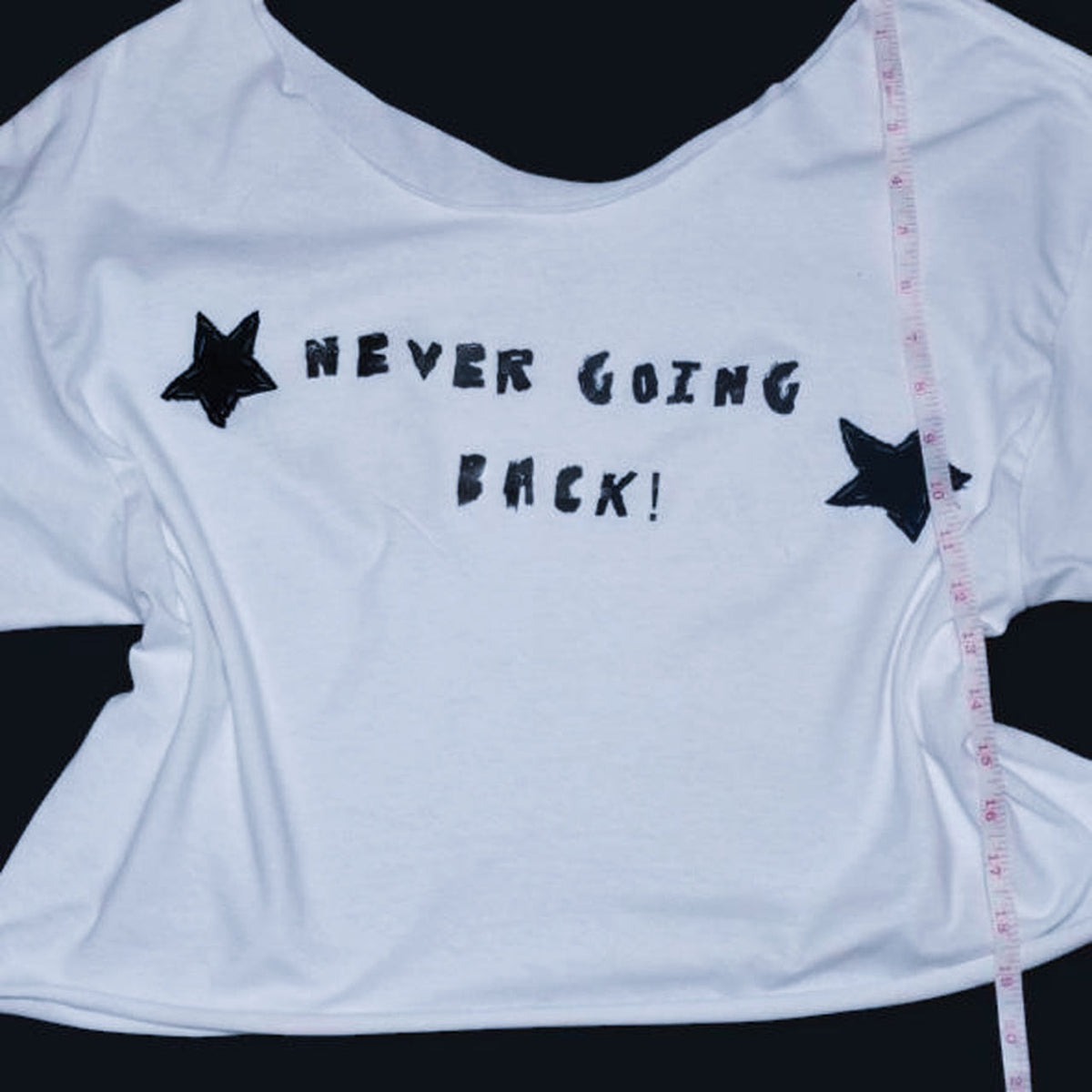 white off the shoulder phoebe bridgers inspired graphic tee | hand sewed black fabric stars